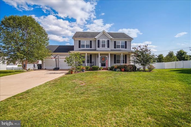 colonial inspired home featuring covered porch, a garage, and a front lawn