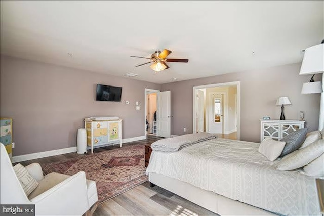 bedroom with hardwood / wood-style flooring and ceiling fan