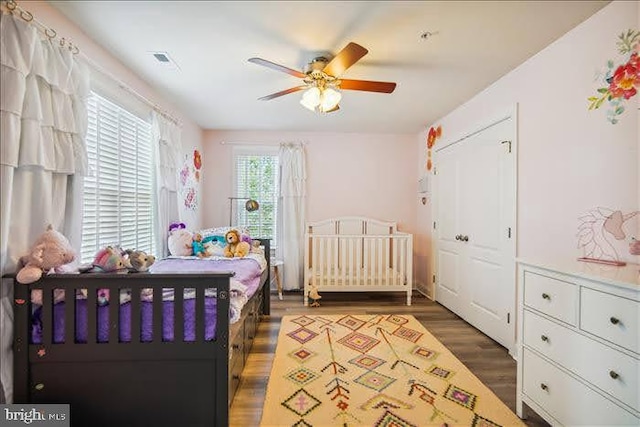 bedroom featuring ceiling fan and dark hardwood / wood-style floors