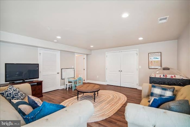 living room featuring dark wood-type flooring