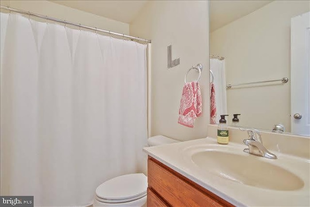 bathroom with vanity and toilet