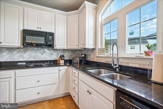 kitchen with white cabinetry, black appliances, and sink