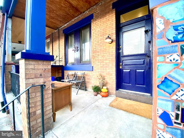 doorway to property featuring a porch