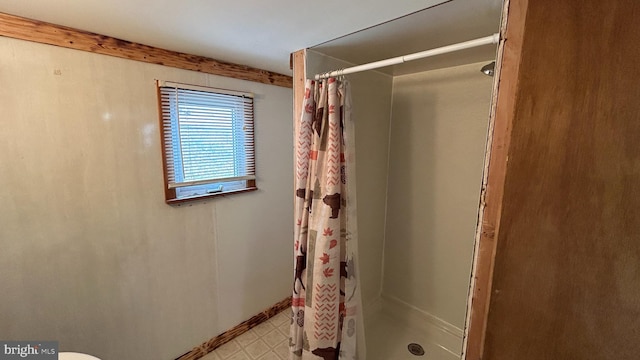 bathroom with a shower with shower curtain