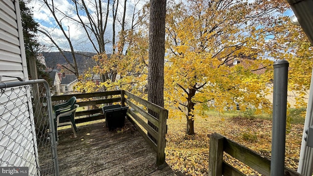 wooden deck with a mountain view