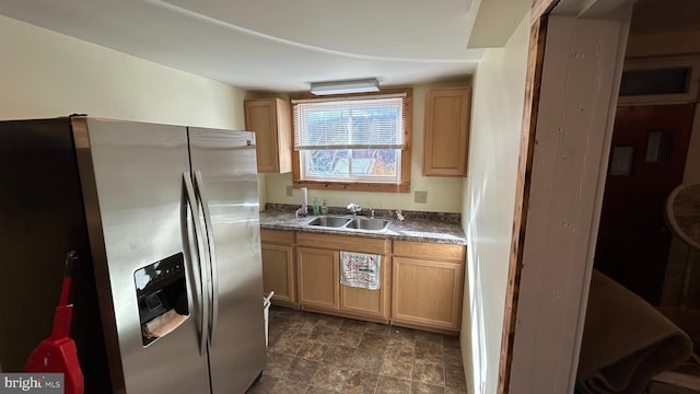 kitchen with sink and stainless steel fridge