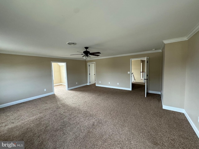 carpeted spare room with ceiling fan and ornamental molding