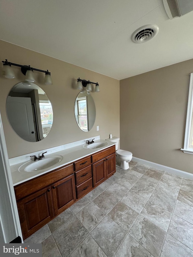 bathroom with vanity and toilet