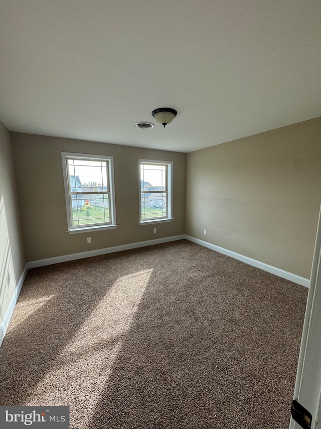 view of carpeted spare room