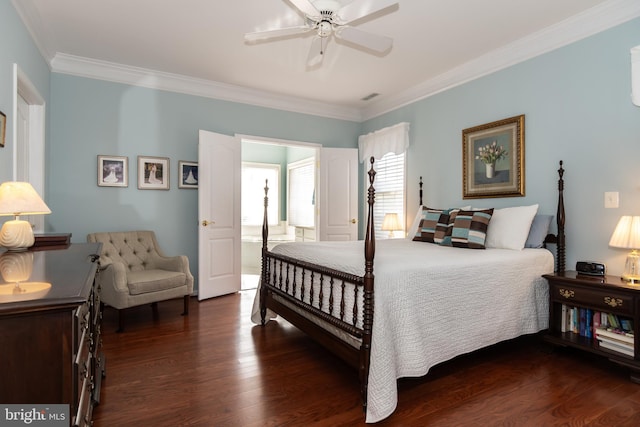 bedroom featuring ceiling fan, connected bathroom, dark hardwood / wood-style flooring, and ornamental molding