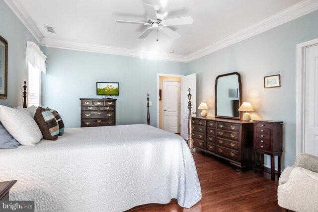 bedroom with dark hardwood / wood-style flooring, ceiling fan, and crown molding