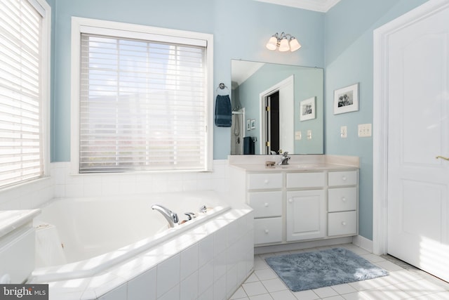 bathroom featuring a relaxing tiled tub, vanity, tile patterned floors, and ornamental molding