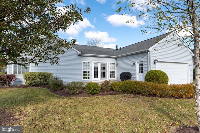 exterior space with a garage and a front yard