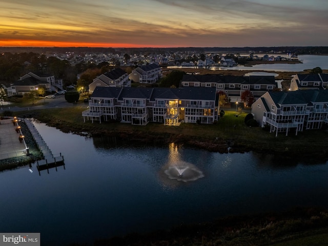 aerial view at dusk with a water view