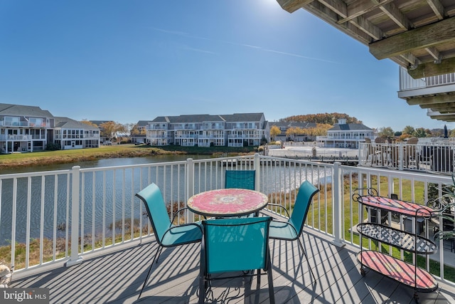 balcony featuring a water view