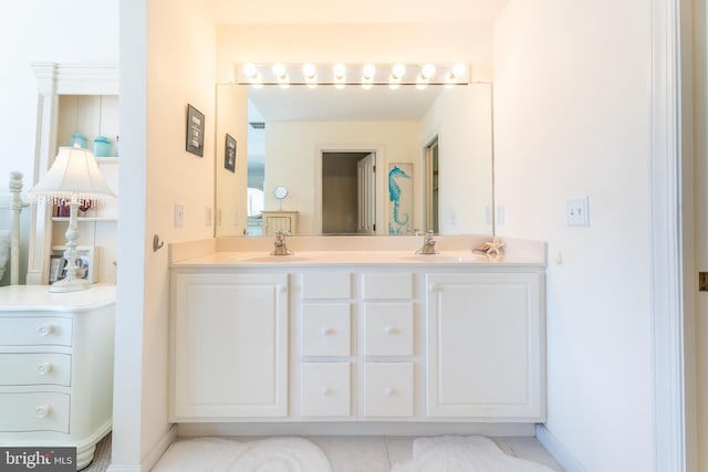 bathroom with vanity and tile patterned floors