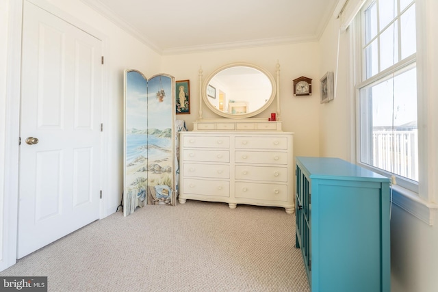 bedroom featuring light carpet and crown molding