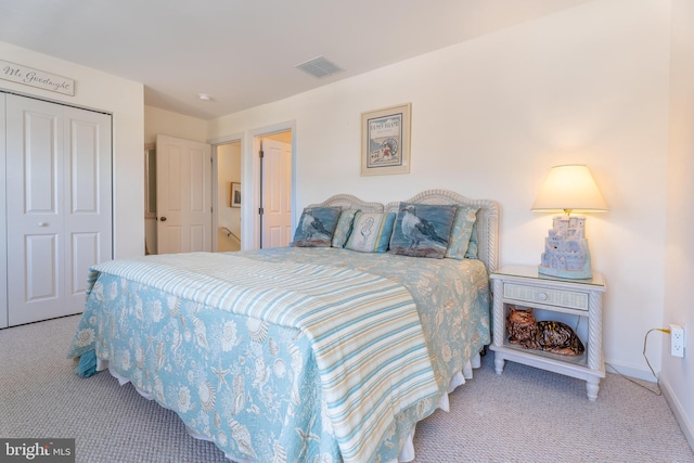 carpeted bedroom with a closet