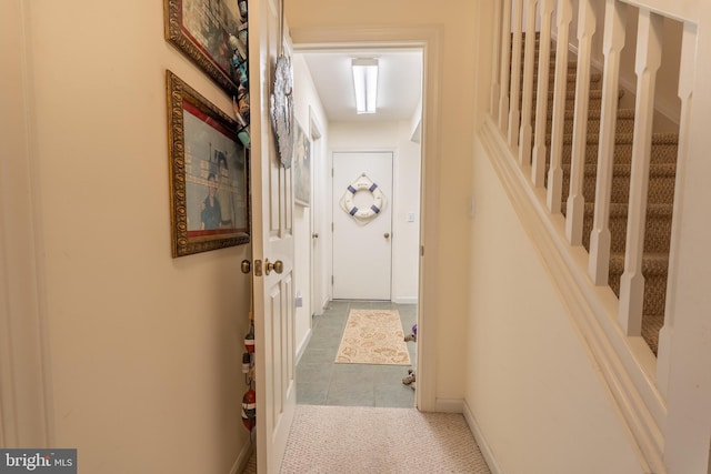 hallway featuring tile patterned floors