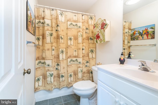 full bathroom featuring vanity, shower / bath combo with shower curtain, toilet, and tile patterned floors