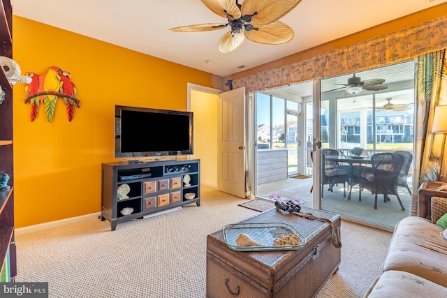 living room featuring ceiling fan and carpet