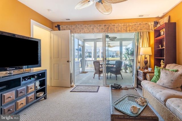 living room featuring carpet flooring and ceiling fan