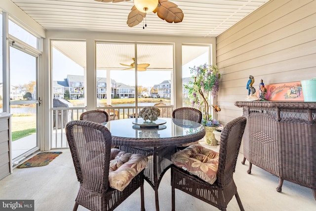 sunroom featuring wooden ceiling and plenty of natural light