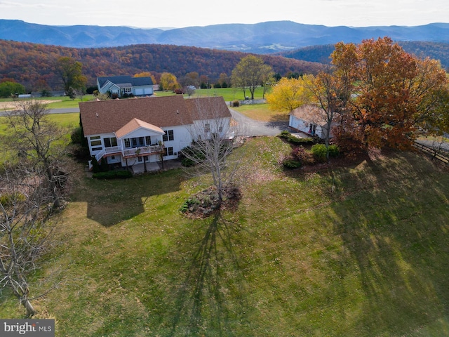 birds eye view of property with a mountain view