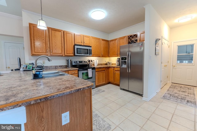 kitchen with kitchen peninsula, sink, crown molding, appliances with stainless steel finishes, and decorative light fixtures