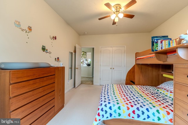 carpeted bedroom with a closet and ceiling fan