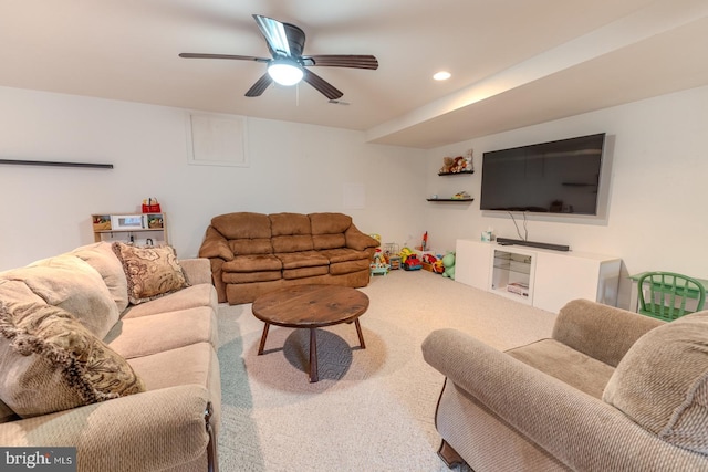 carpeted living room featuring ceiling fan