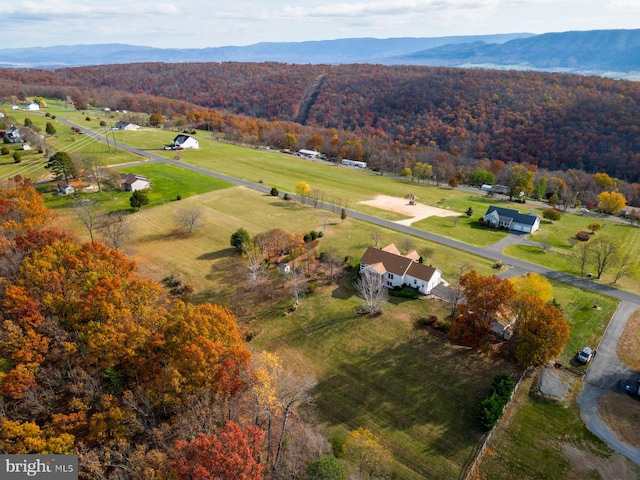 drone / aerial view with a mountain view and a rural view