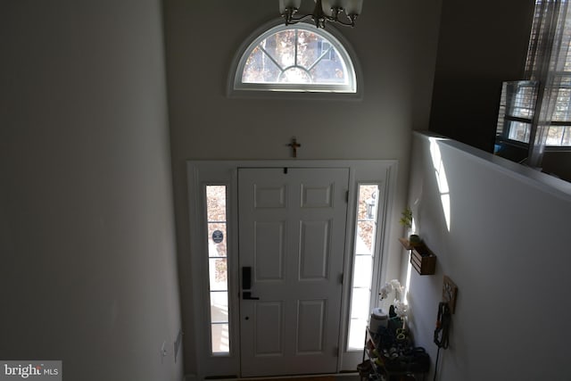 foyer with an inviting chandelier