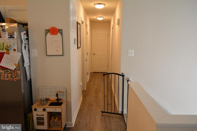 hall with light hardwood / wood-style floors