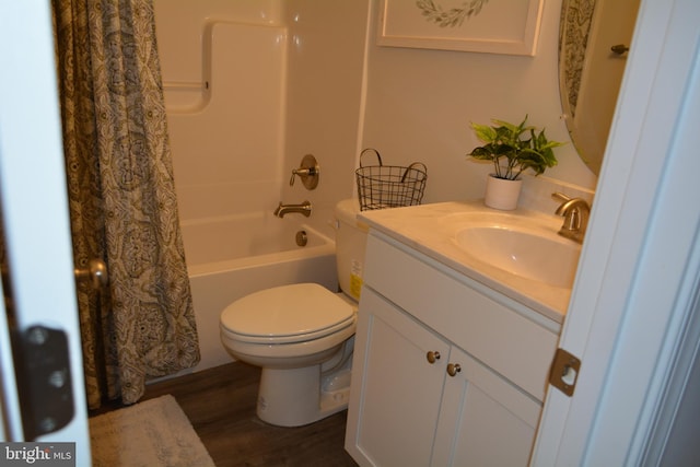 full bathroom with vanity, shower / bath combo, hardwood / wood-style flooring, and toilet