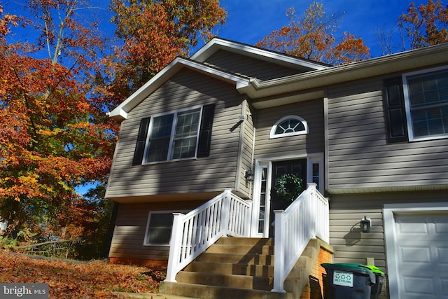 view of exterior entry featuring a garage