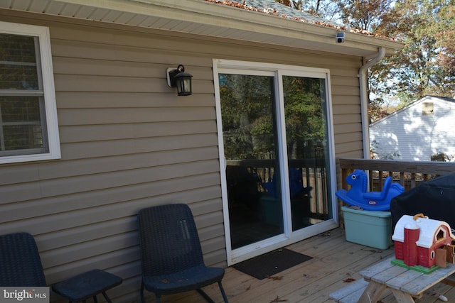 wooden terrace with area for grilling