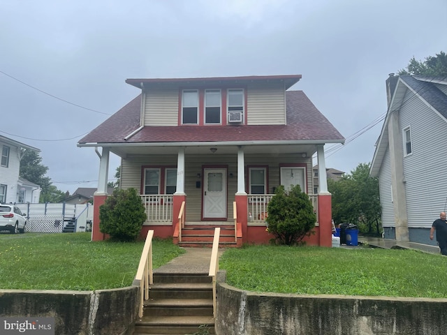 bungalow-style home with a front yard and a porch