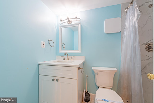 bathroom with vanity, a shower with shower curtain, and toilet