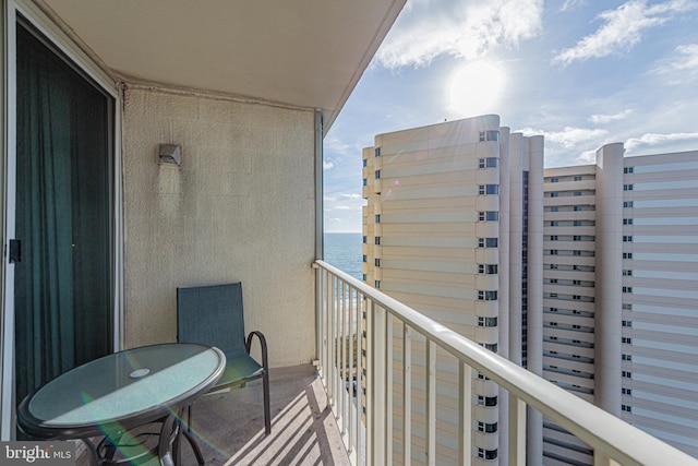 balcony featuring a water view