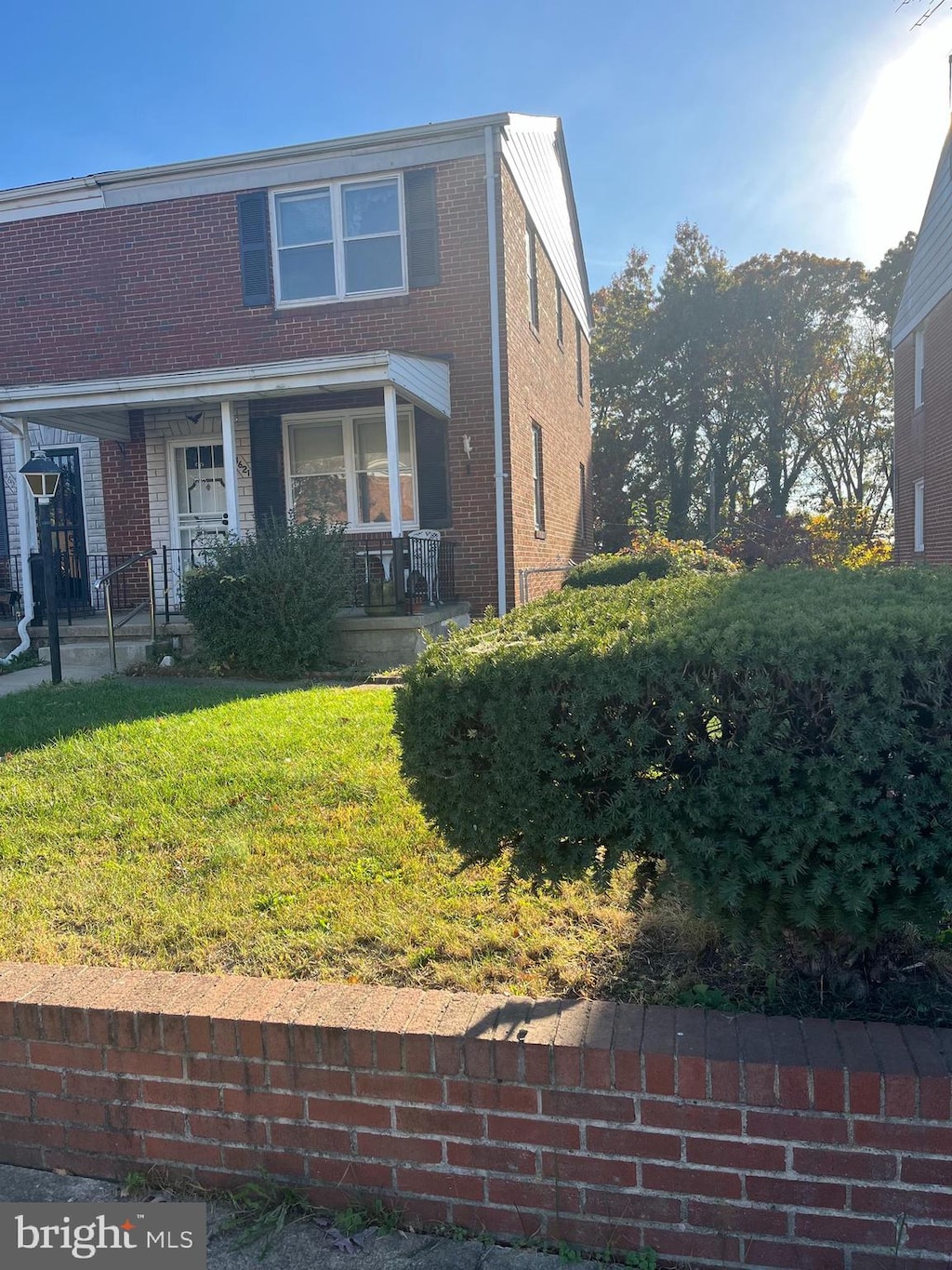 view of front of house featuring a front yard and a porch