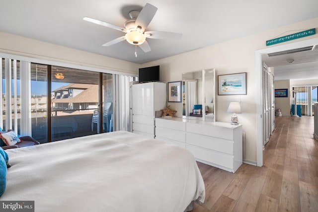 bedroom with light hardwood / wood-style floors, ceiling fan, and access to exterior