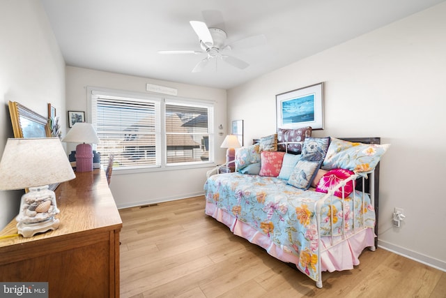 bedroom featuring ceiling fan and light hardwood / wood-style floors