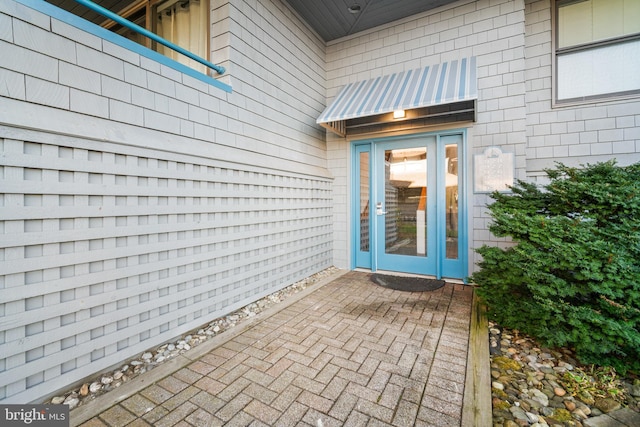 doorway to property featuring a patio area