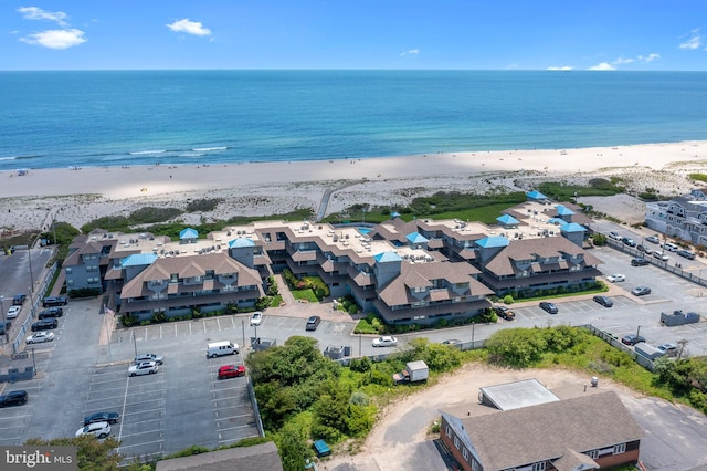 bird's eye view featuring a beach view and a water view