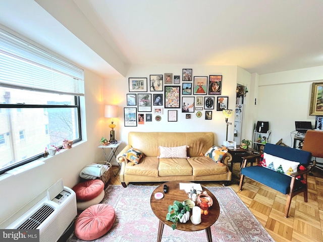 living room with parquet flooring and a wall unit AC