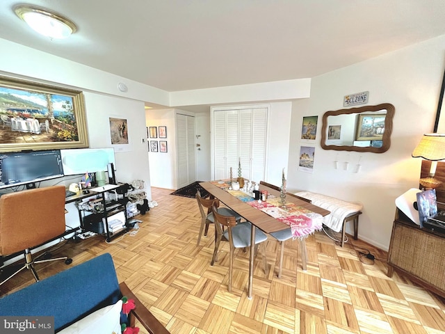 dining room featuring light parquet floors