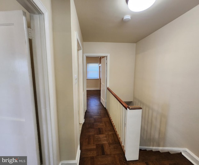 hallway with dark parquet floors