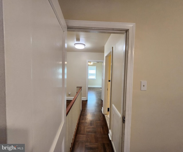 hall featuring dark parquet flooring