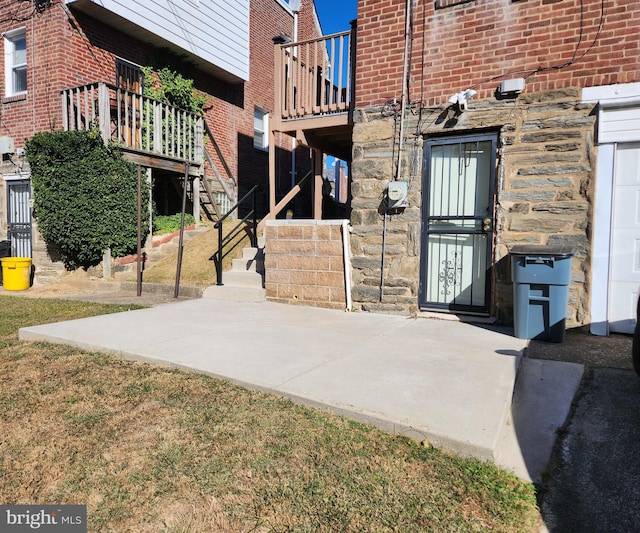 entrance to property with a patio